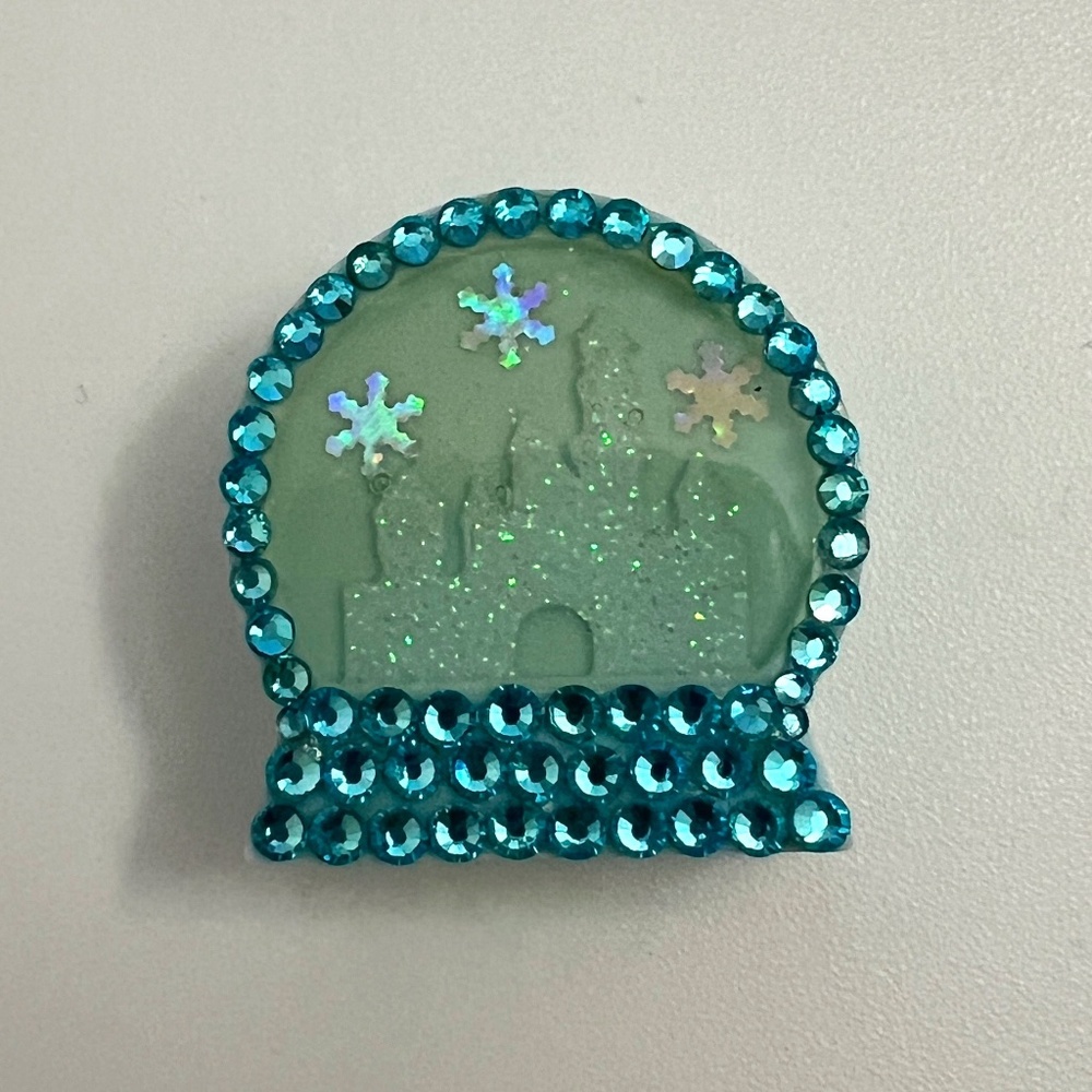 The Fawn Doe blue winter Disneyland snow globe straw charm